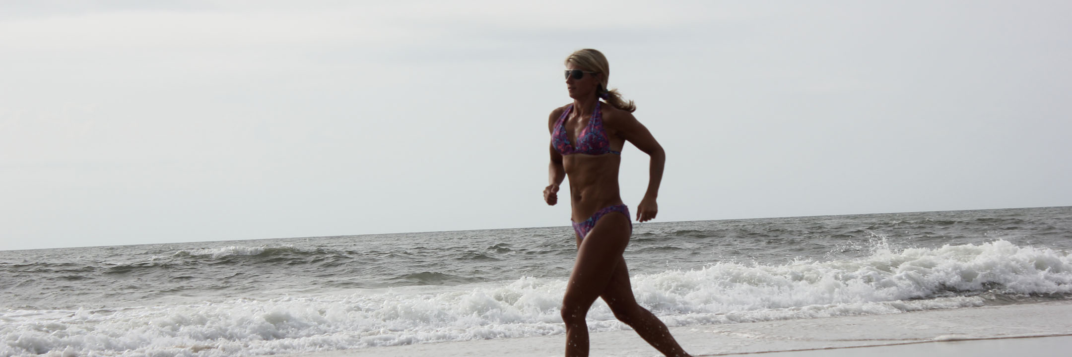 Steph running on beach